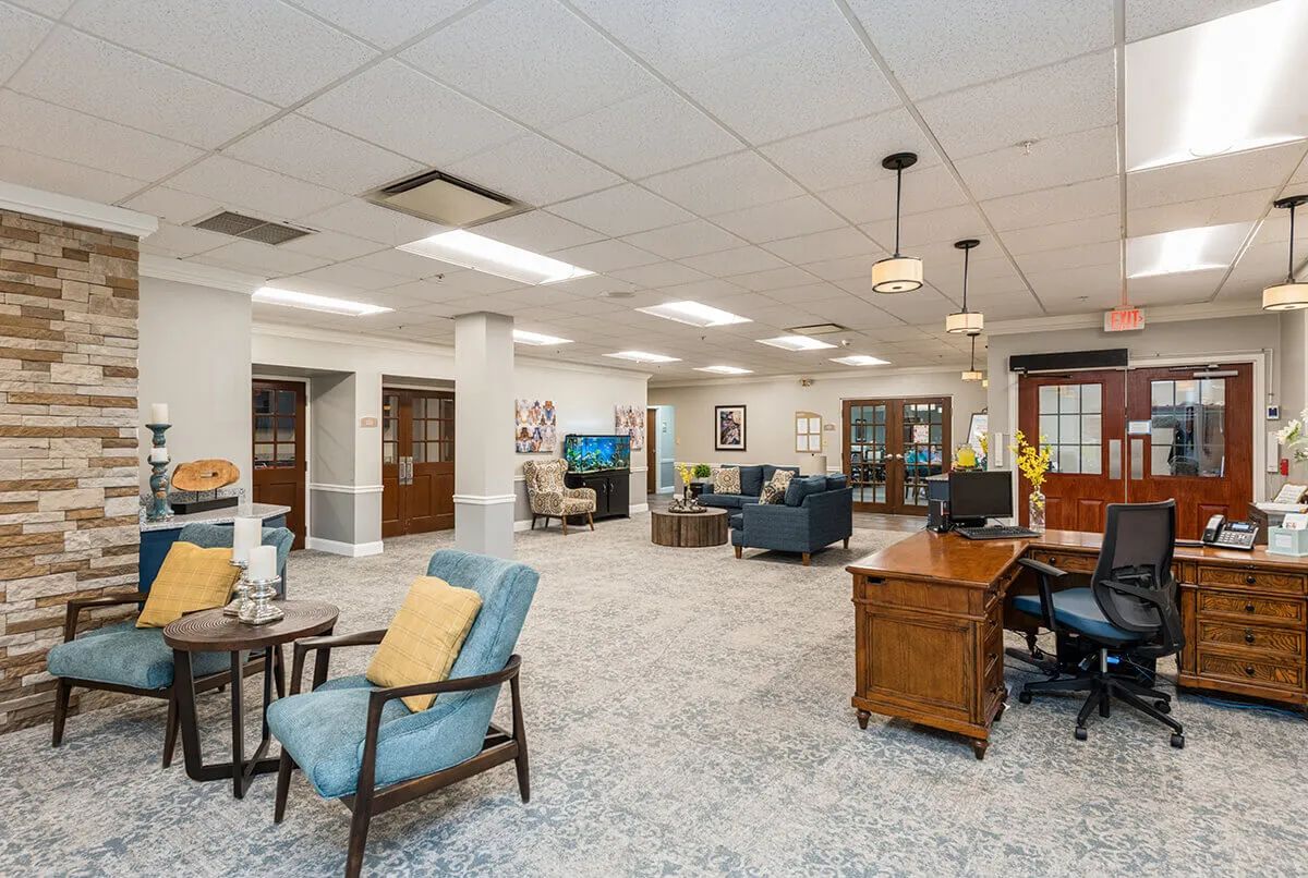 A spacious office lobby with comfortable seating and elegant furnishings.