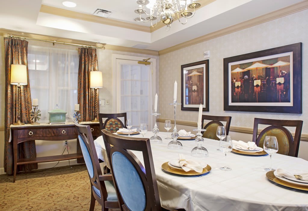An elegant dining room with a well-set table and stylish decor.