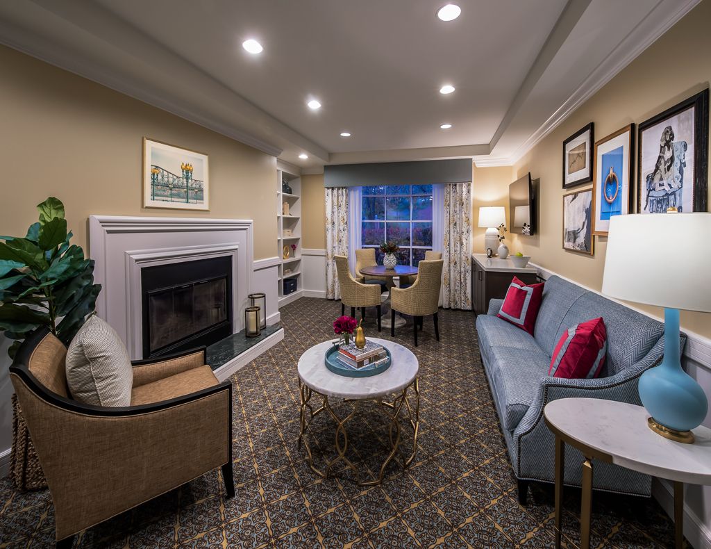 Cozy living room with modern decor and a fireplace.