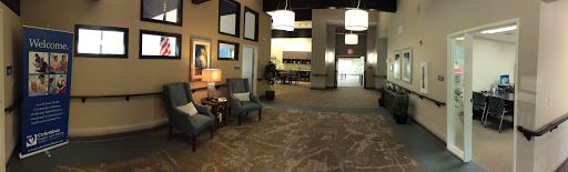 A modern lobby featuring comfortable seating, stylish lighting, and a welcoming atmosphere.