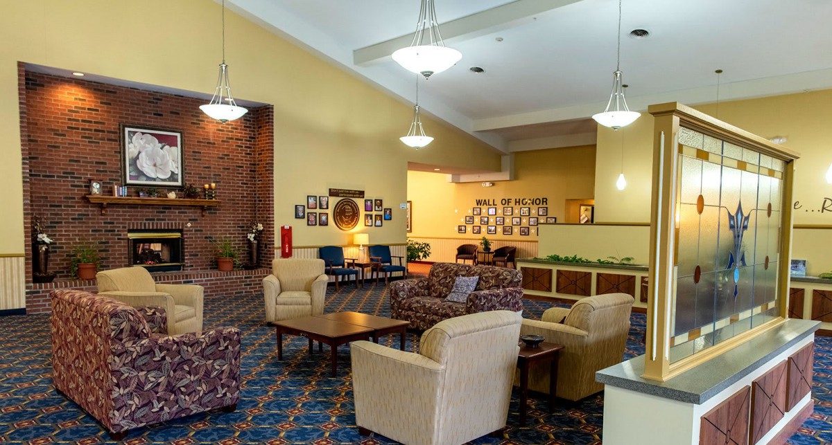 Spacious hotel lobby with comfortable seating and warm lighting.