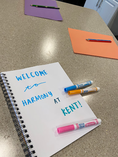 A warm welcome message written artistically in a notebook with colorful markers.