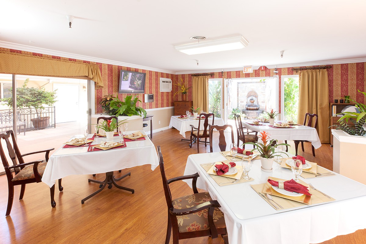 Elegant dining room with neatly set tables and warm, inviting decor.