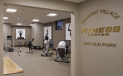 An indoor fitness center with various exercise equipment.