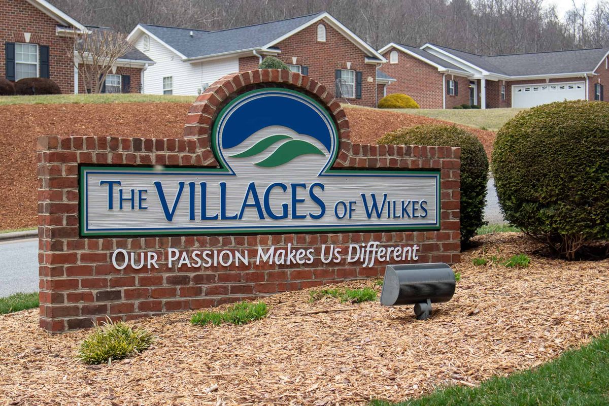 Entrance sign for The Villages of Wilkes residential community.
