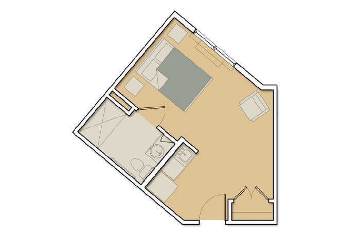 A floor plan showing the layout of a single room apartment with distinct living and sleeping areas.