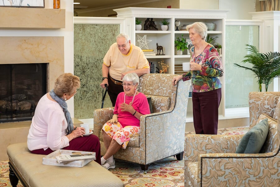 A group of seniors socializing in a community setting.