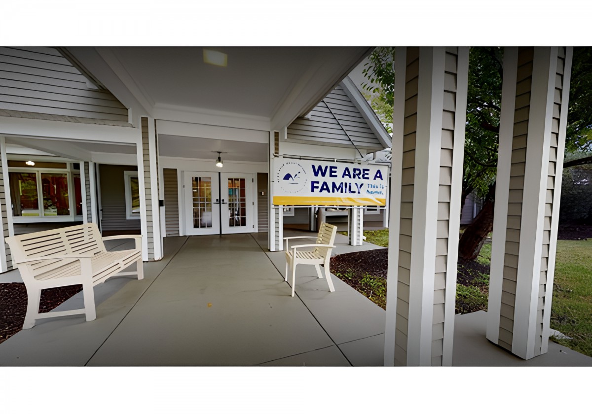 Entrance to a building with a sign reading 'We Are a Family'.