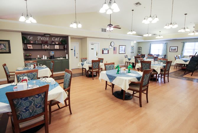 A cozy dining room with neatly arranged tables and comfortable chairs.