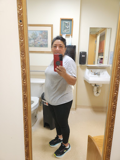A casual selfie taken in a bathroom mirror.