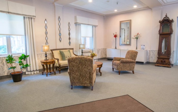 A cozy living room with comfortable seating and elegant decor.