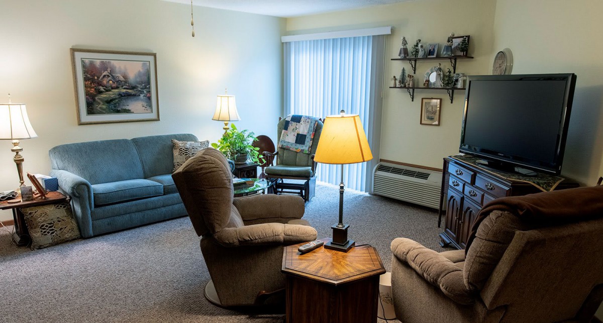 Cozy living room with comfortable seating and warm lighting.