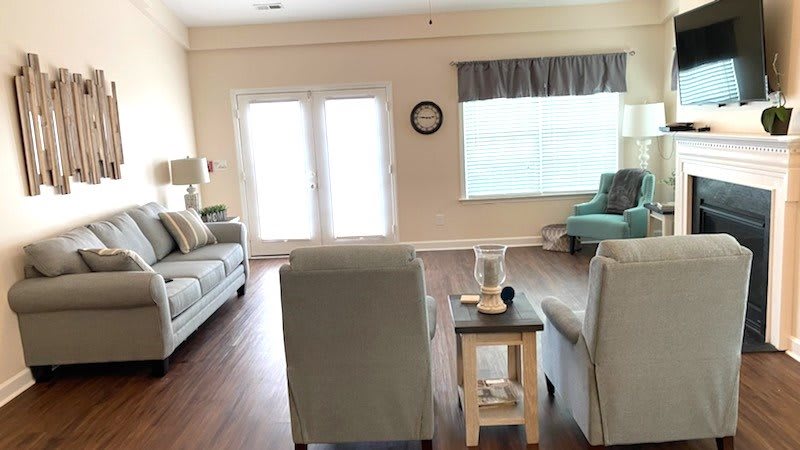 A cozy living room with comfortable seating and natural light.