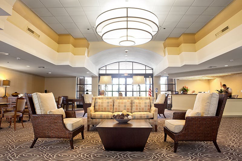 A modern hotel lobby with comfortable seating and stylish lighting.