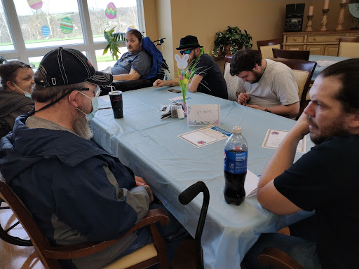 A group of individuals engaging in a social activity at a community center.
