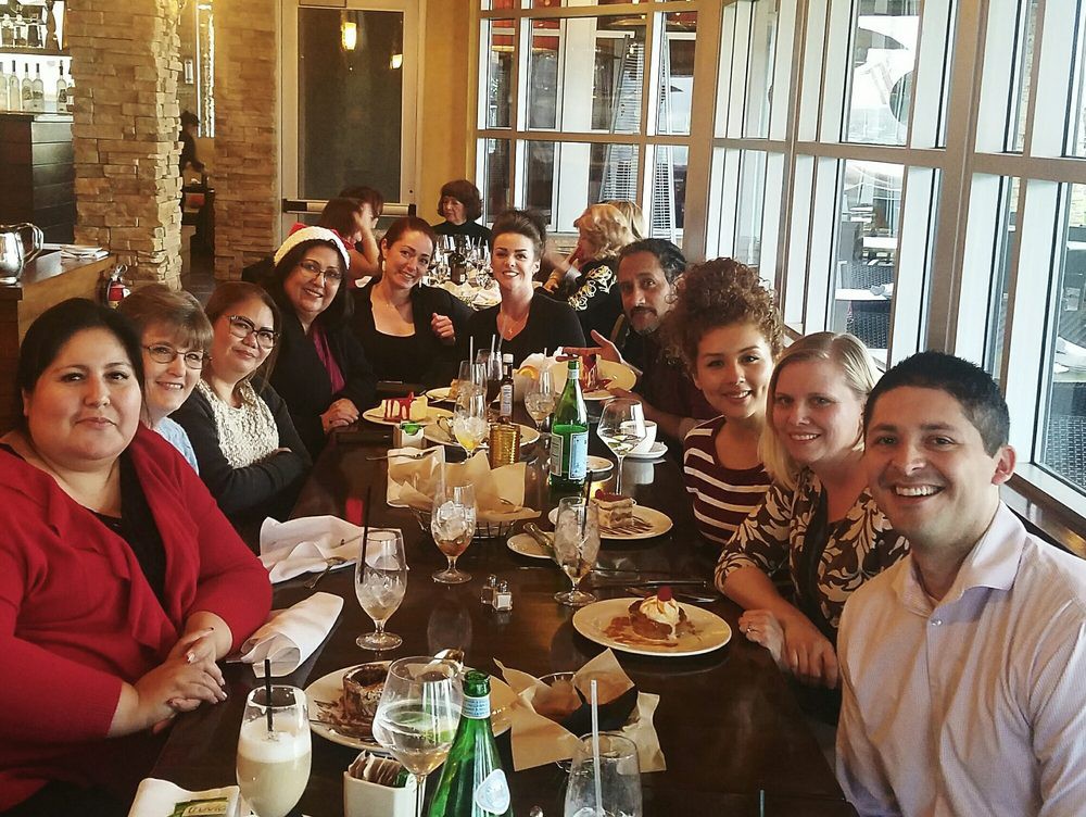 A group of people enjoying a meal together at a restaurant.