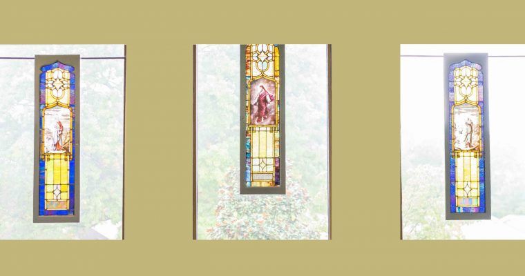 A stained glass window depicting religious art with vibrant colors.