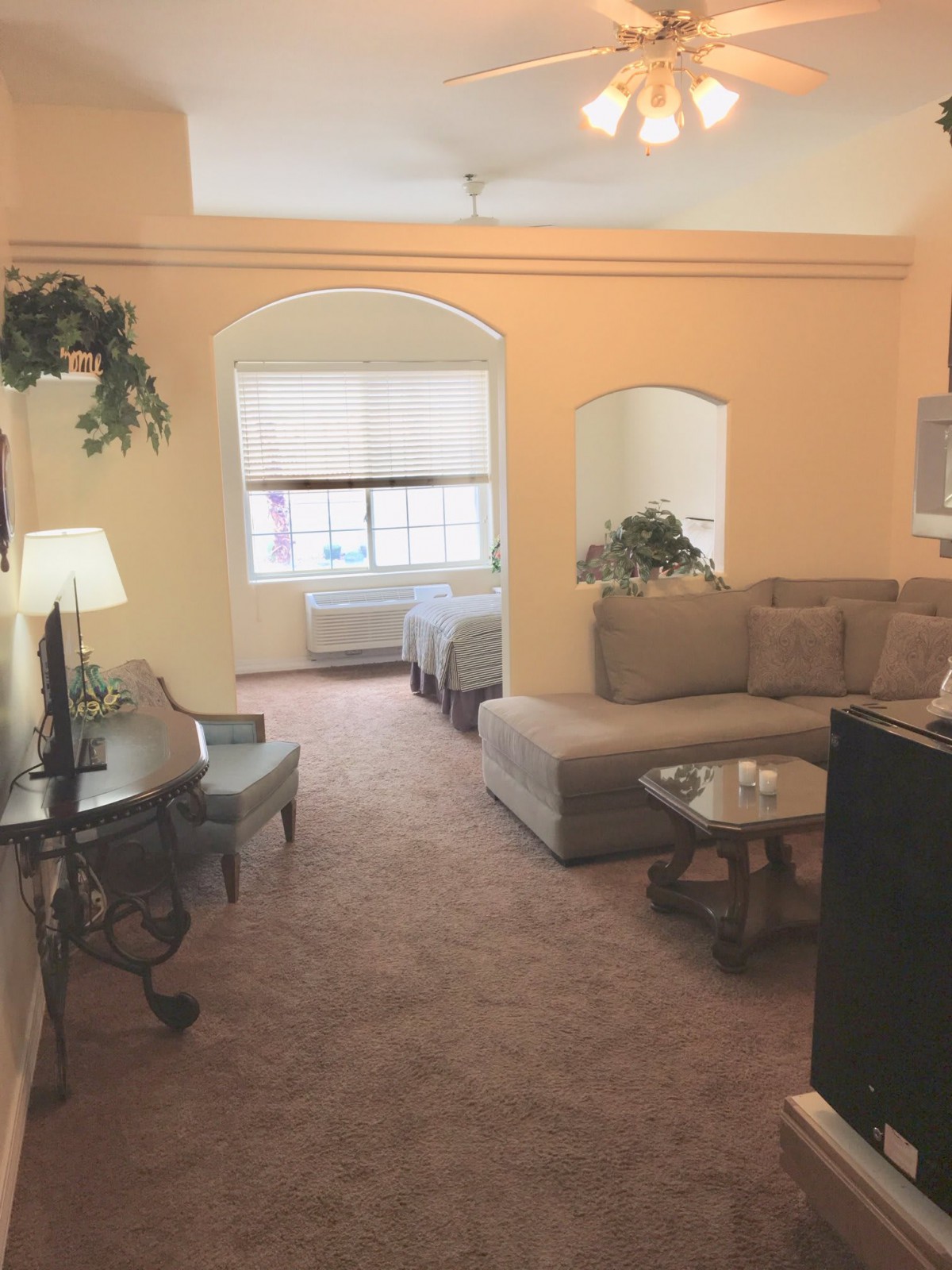 A cozy living room with a sectional sofa and elegant decor.