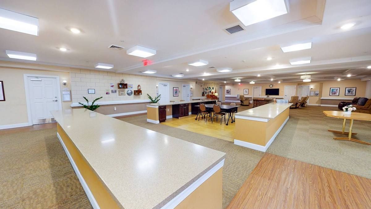 A modern and spacious kitchen interior with ample countertops and a seating area.