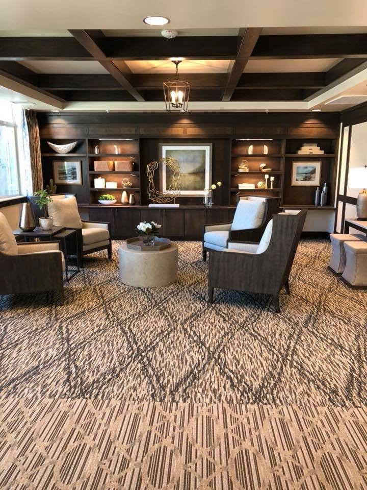 A cozy lounge area with modern furnishings and decorative elements.