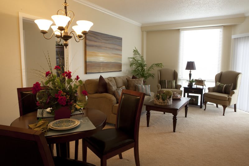 A cozy living and dining area with warm lighting and tasteful decor.