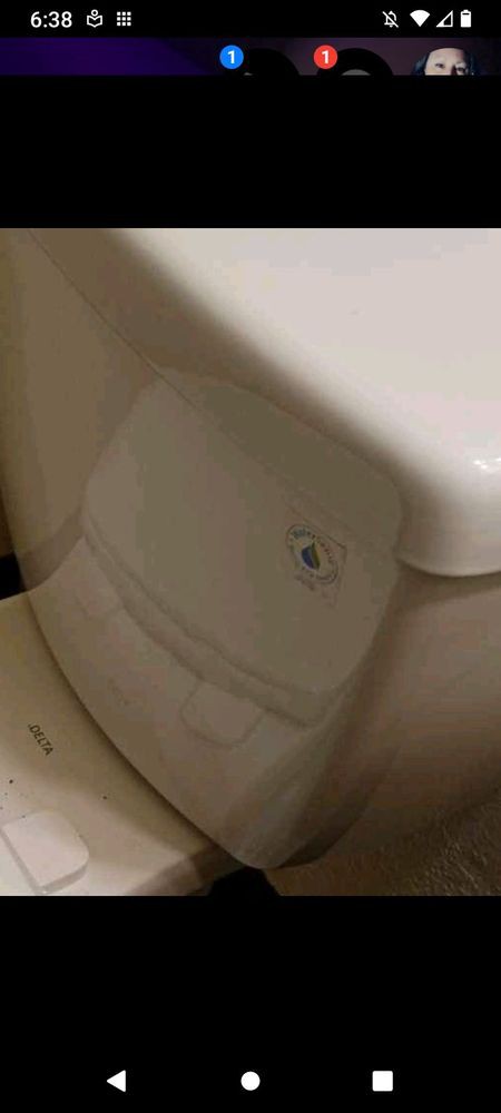 A close-up view of a toilet in a bathroom setting.