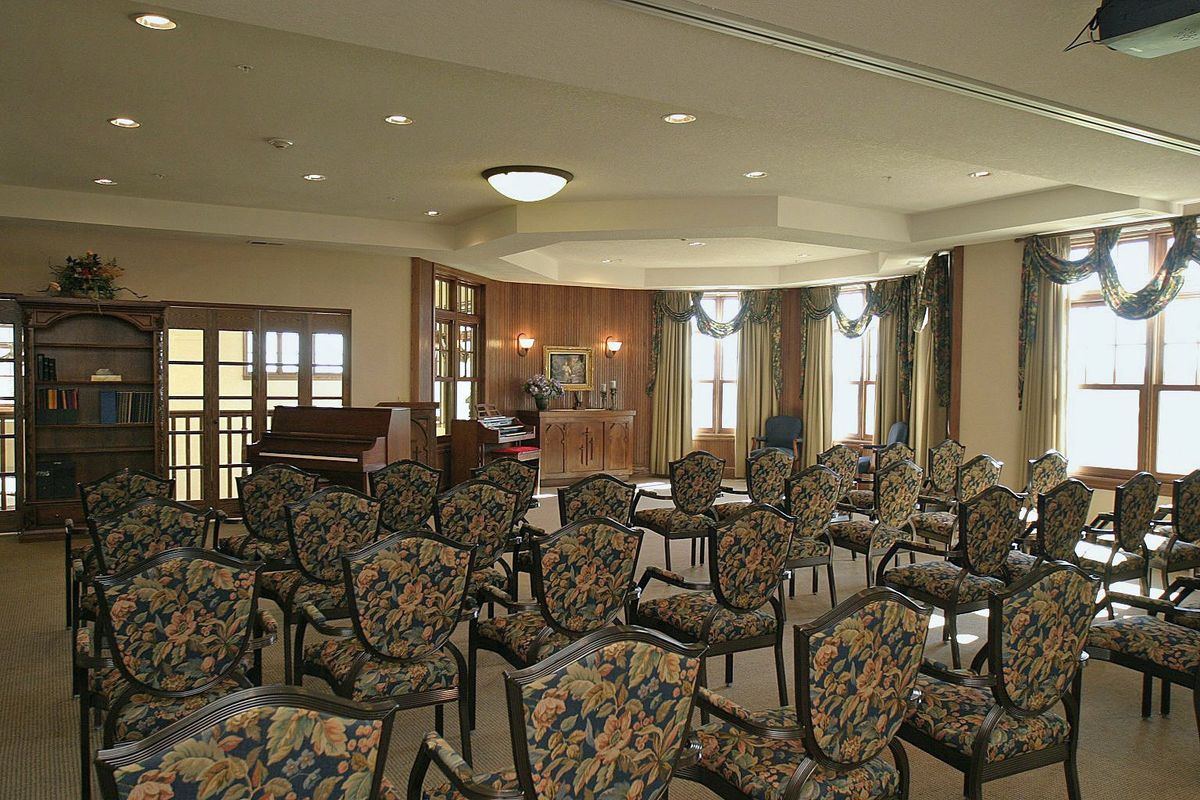 A well-appointed conference room with patterned chairs and elegant decor.