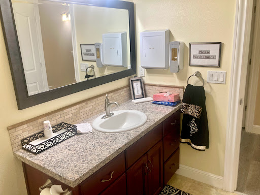 A neatly organized bathroom with a stylish vanity and modern fixtures.