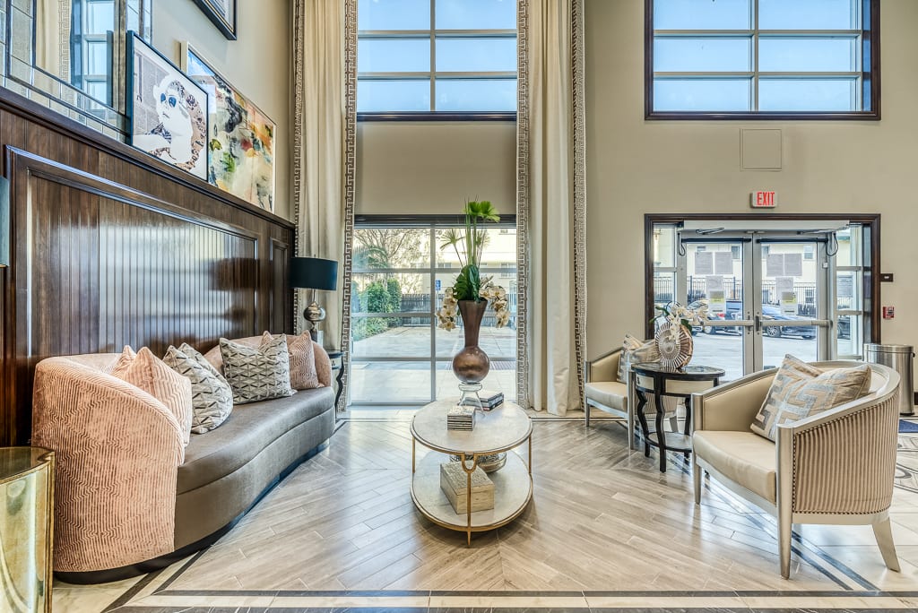 A modern living room with large windows and stylish decor.