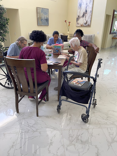 Seniors engaging in a group activity at a care facility.