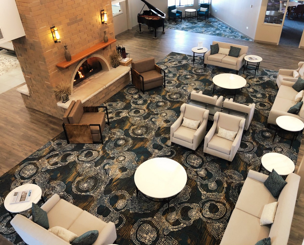 Spacious hotel lobby with stylish seating and decor.