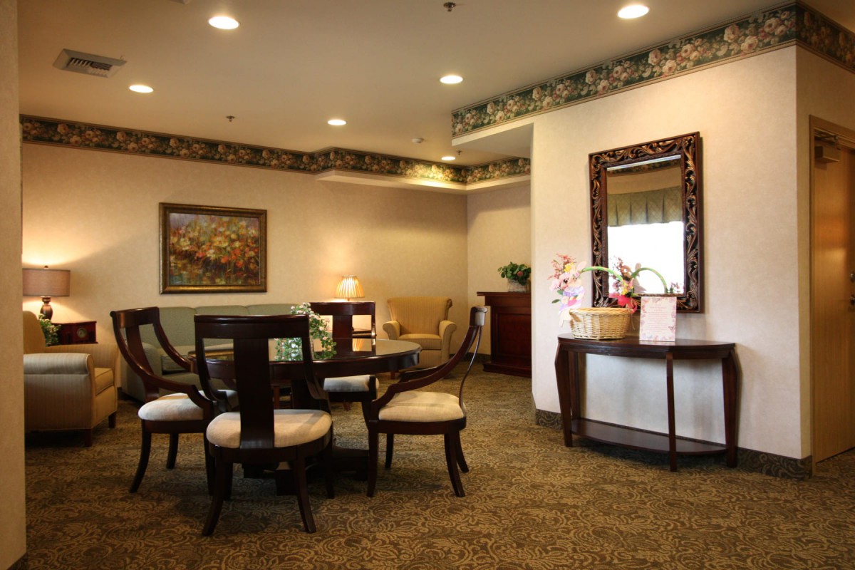 A cozy living room with elegant furniture and warm lighting.