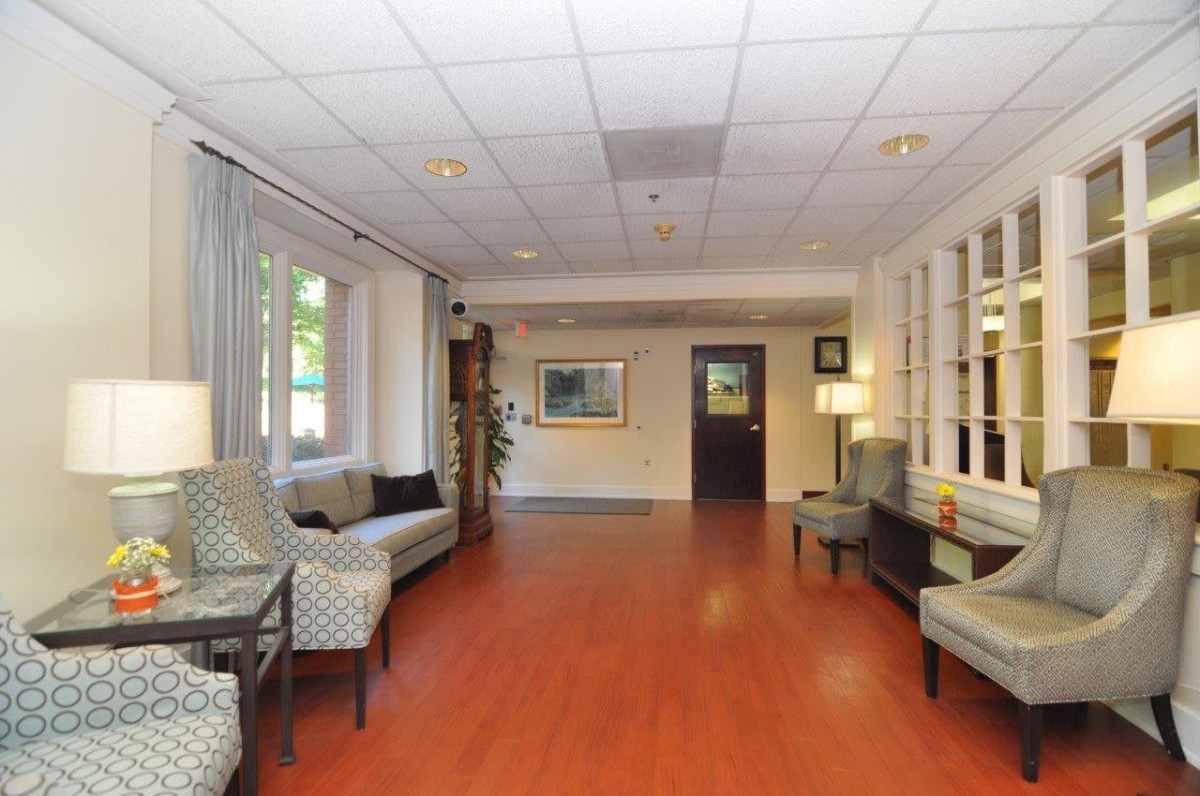 A spacious lobby area with comfortable seating and natural light.