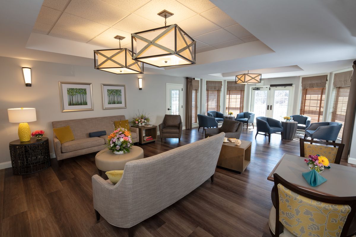 A modern living room featuring stylish furniture and contemporary lighting fixtures.