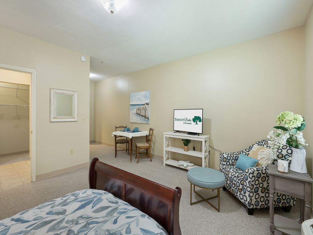An inviting living space featuring a cozy seating area and small dining setup.