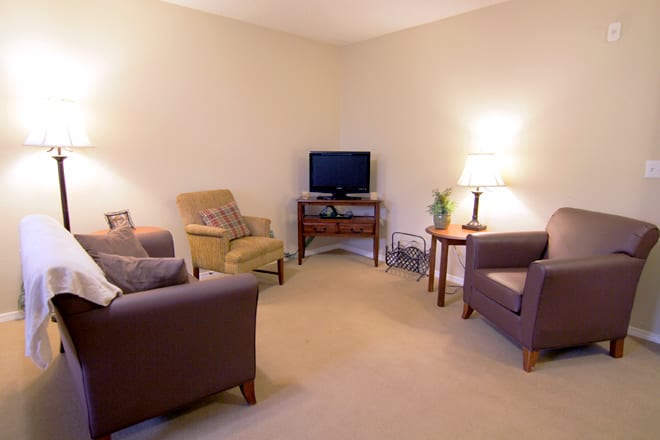 Cozy living room with comfortable seating and a TV.