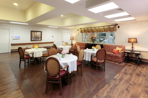 A welcoming dining space with elegantly set tables and comfortable seating.