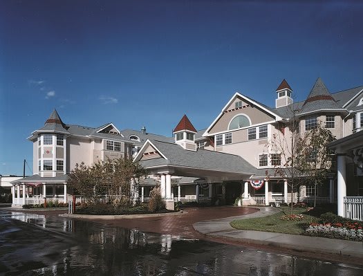 A picturesque resort with classic architectural features under a clear blue sky.