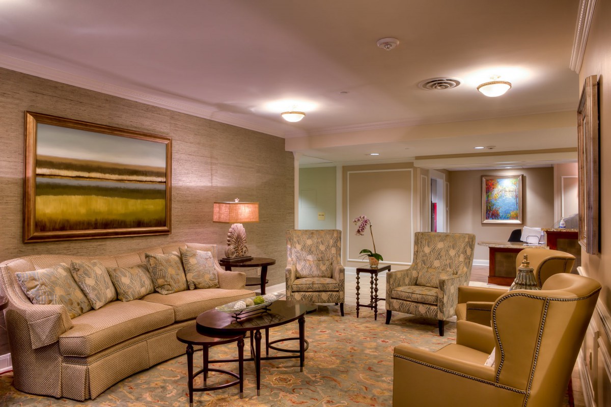 A modern living room with comfortable seating, elegant lighting, and stylish decor.