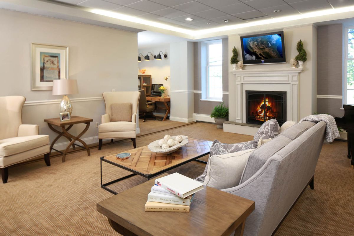 A cozy living room featuring a fireplace and modern decor.