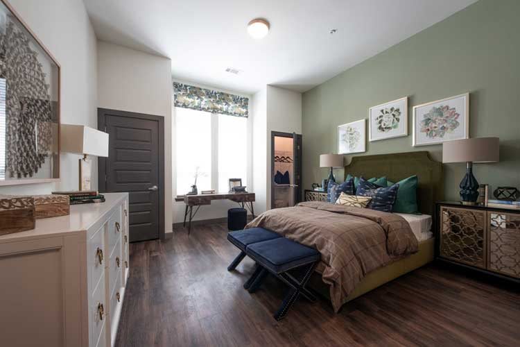 A modern and cozy bedroom with stylish furnishings and warm decor.