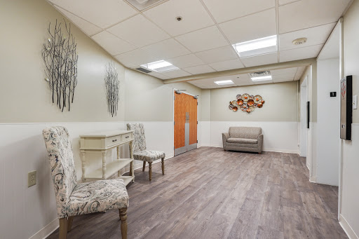 A modern waiting area featuring stylish furniture and a calm color palette.