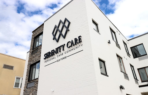The exterior of the Serenity Care facility, showcasing its modern design and branding.