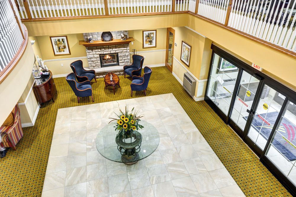 Elegant hotel lobby with a cozy seating area and fireplace.