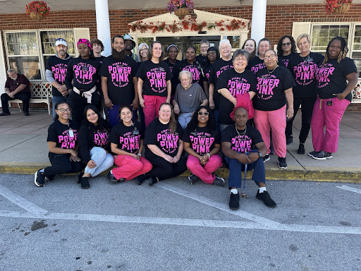 A dedicated team united in purpose, showcasing their spirit with matching outfits during a community event.