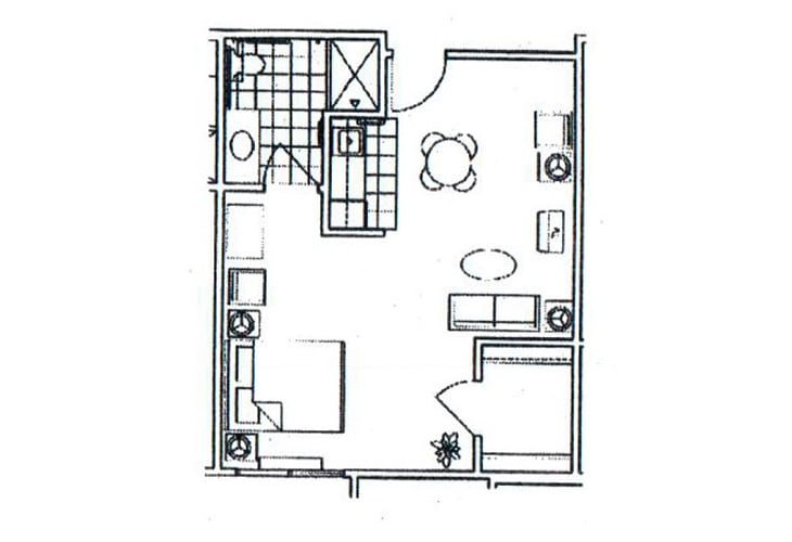 A compact floor plan featuring a living room, kitchen, bedroom, and bathroom.
