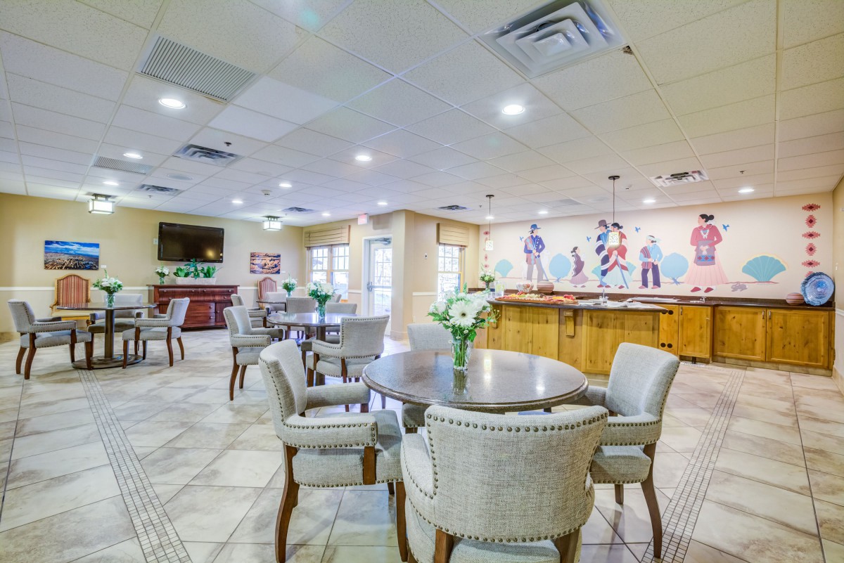 A spacious indoor dining area with modern decor and comfortable seating arrangements.