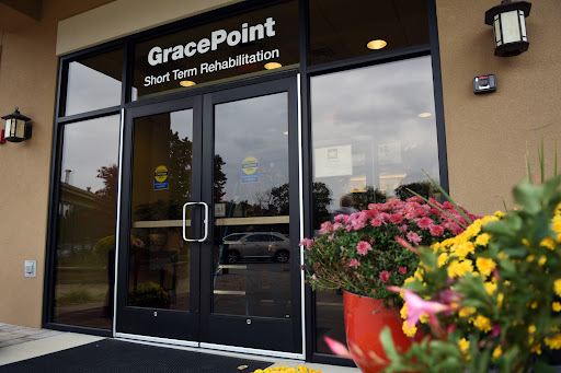 The entrance of GracePoint Short Term Rehabilitation, adorned with colorful flowers.