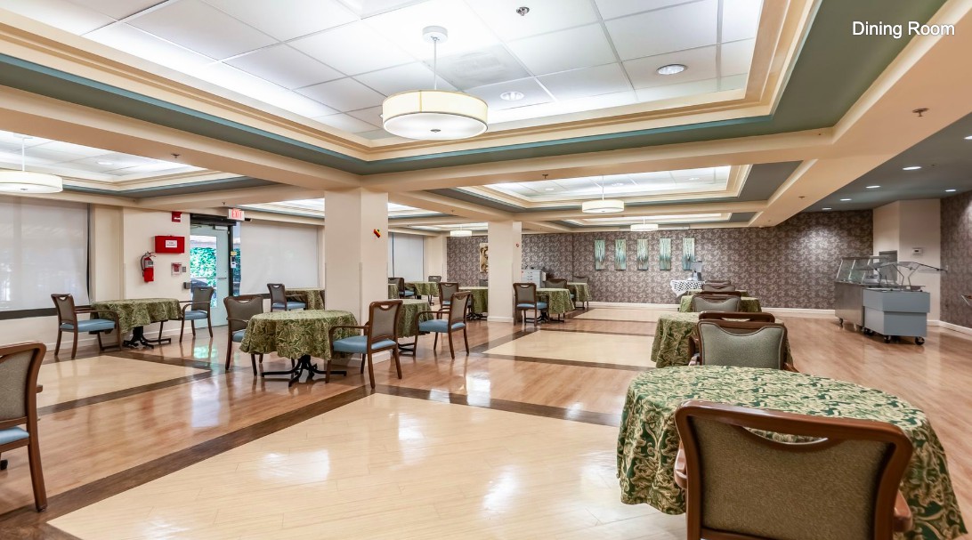 A spacious and elegantly decorated dining area with tables set for service.
