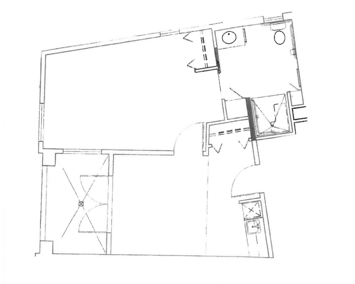 A black and white floor plan depicting the layout of a building with labeled rooms and structural details.
